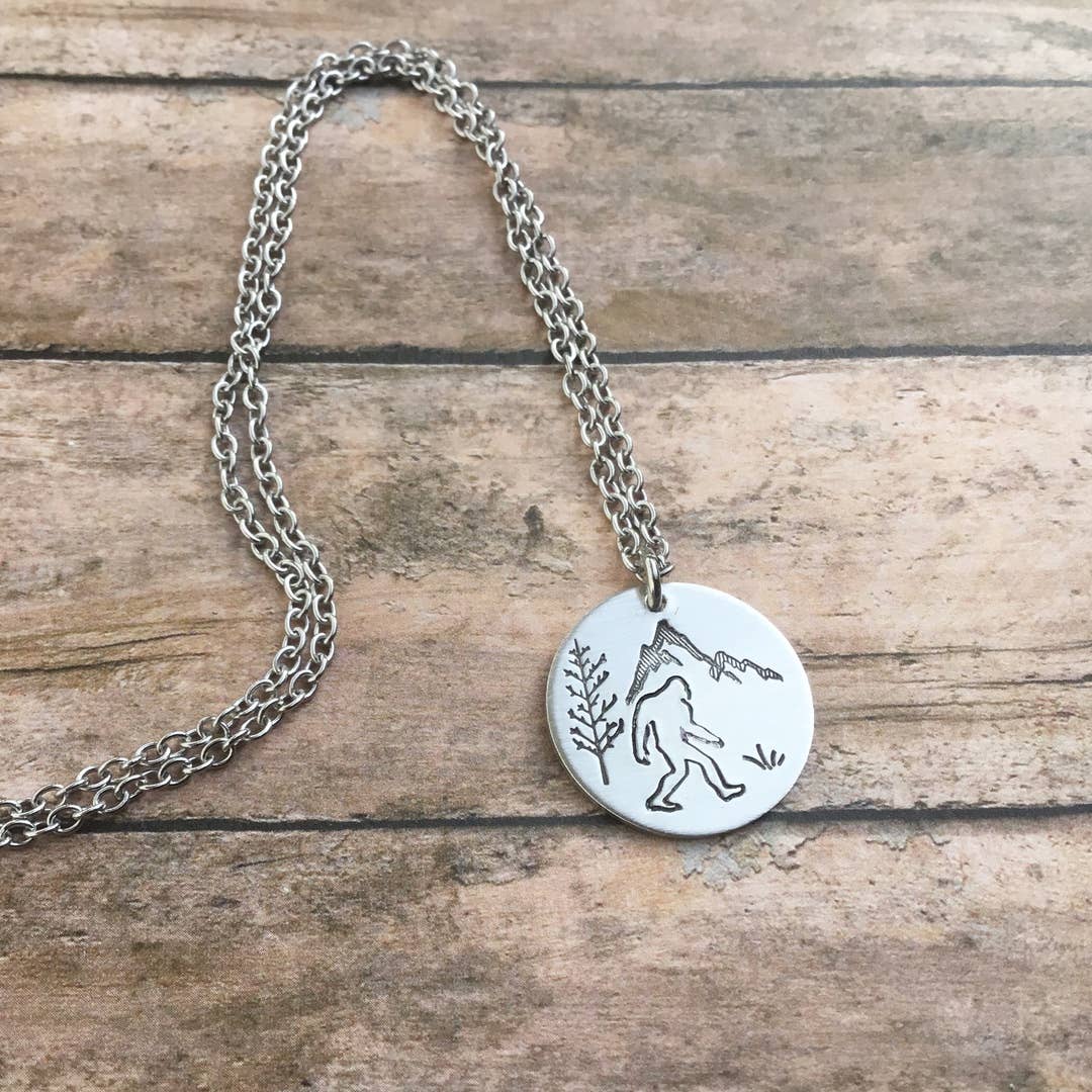 Sasquatch forest scene circular pendant
