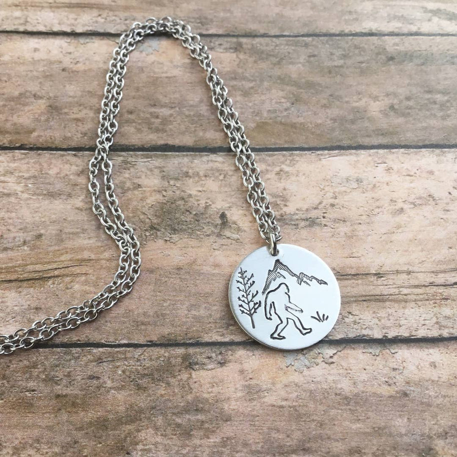 Sasquatch forest scene circular pendant