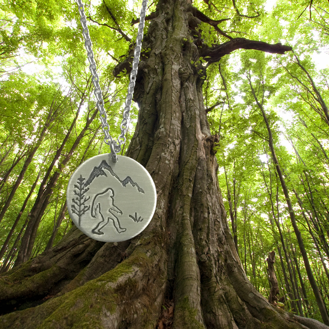 Sasquatch forest scene circular pendant